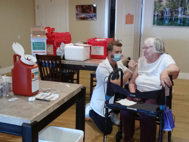 Applewood Our House Resident Receiving COVID Vaccination