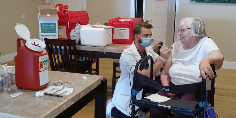 Applewood Our House Resident Receiving COVID Vaccination